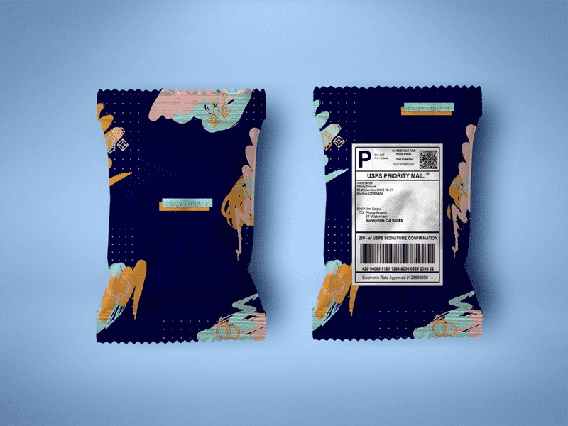 hai bưu phẩm cạnh nhau, cả hai đều màu xanh đậm với hoa văn đậm